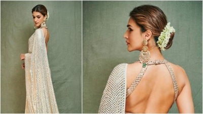 The 'Heropanti' actor opted for an embellished saree by Manish Malhotra for Ganpati celebrations. She teamed it with a halterneck blouse and accessorised her look with long golden earrings and bangles. (Instagram/@manishmalhotra05)