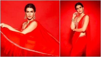 Kriti painted the town red when she wore a bright red saree by ace designer Anita Dongre. She paired it with a red shimmery sleeveless blouse and added long earrings to complete the look. (Instagram/@kritisanon)