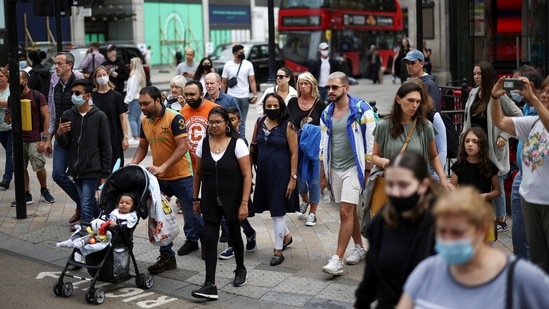 People walk through Oxford Circus, amid the Covid-19 outbreak, in London, Britain.(Reuters)