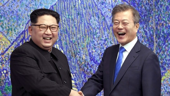 FILE - In this April 27, 2018, file photo, North Korean leader Kim Jong Un, left, poses with South Korean President Moon Jae-in for a photo inside the Peace House at the border village of Panmunjom in Demilitarized Zone, South Korea. The presidential office in Seoul said Tuesday, July 27, 2021, Moon and Kim have agreed to restore suspended communication channels and improve ties. (Korea Summit Press Pool via AP, File)(AP)