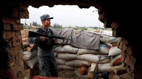 An Afghan policeman keeps watch at the check post on the outskirts of Kabul, Afghanistan July 13, 2021. (REUTERS)