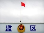 A Chinese national flag flies over a vehicle entrance to the inmate detention area at the Urumqi No. 3 Detention Center in Dabancheng in western China's Xinjiang Uyghur Autonomous Region, on April 23, 2021. A Chinese national flag flies over a vehicle entrance to the inmate detention area at the Urumqi No. 3 Detention Center in Dabancheng in western China's Xinjiang Uyghur Autonomous Region, on April 23, 2021.
