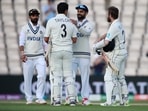India's captain Virat Kohli, second right, congratulates New Zealand's Ross Taylor and captain Kane Williamson, right, on their win on the sixth day of the World Test Championship final cricket match between New Zealand and India(AP) India's captain Virat Kohli, second right, congratulates New Zealand's Ross Taylor and captain Kane Williamson, right, on their win on the sixth day of the World Test Championship final cricket match between New Zealand and India(AP)
