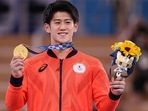 Daiki Hashimoto of Japan poses with the gold medal. 