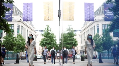 People walk along Oxford Street, amid the coronavirus disease (Covid-19) outbreak, in London, Britain, (Reuters)