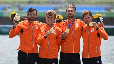 Tokyo 2020 Olympics - Rowing - Men's Quadruple Sculls - Medal Ceremony - Sea Forest Waterway, Tokyo, Japan - July 28, 2021. Gold medallists Dirk Uittenbogaard of the Netherlands, Abe Wiersma of the Netherlands, Tone Wieten of the Netherlands and Koen Metsemakers of the Netherlands celebrate with their medals REUTERS/Piroschka Van De Wouw (REUTERS)