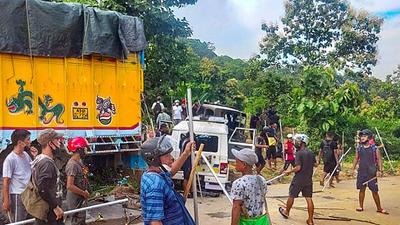 Locals near damaged security force vehicles after clashes on the Assam-Mizoram border at Lailapur in Cachar district on Monday. (PTI) Locals near damaged security force vehicles after clashes on the Assam-Mizoram border at Lailapur in Cachar district on Monday. (PTI)