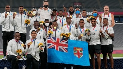 Fiji's team poses with their gold medals after winning men's rugby sevens at the 2020 Summer Olympics, Wednesday, July 28, 2021 in Tokyo, Japan. (AP)
