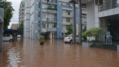 Waterlogging in a housing society in Dhakoli, Zirakpur, after the Wednesday rain. (Sant Arora/HT) Waterlogging in a housing society in Dhakoli, Zirakpur, after the Wednesday rain. (Sant Arora/HT)