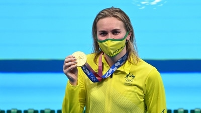 Gold medallist Australia's Ariarne Titmus celebrates with her medal after the final of the women's 200m freestyle swimming event during the Tokyo 2020 Olympic Games at the Tokyo Aquatics Centre in Tokyo on July 28, 2021. (Photo by Attila KISBENEDEK / AFP) (AFP) Gold medallist Australia's Ariarne Titmus celebrates with her medal after the final of the women's 200m freestyle swimming event during the Tokyo 2020 Olympic Games at the Tokyo Aquatics Centre in Tokyo on July 28, 2021. (Photo by Attila KISBENEDEK / AFP) (AFP)