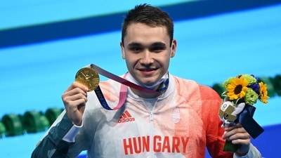 Gold medallist Hungary's Kristof Milak poses after the final of the men's 200m butterfly swimming event during the Tokyo 2020 Olympic Games at the Tokyo Aquatics Centre in Tokyo on July 28, 2021. (Photo by Attila KISBENEDEK / AFP) (AFP) Gold medallist Hungary's Kristof Milak poses after the final of the men's 200m butterfly swimming event during the Tokyo 2020 Olympic Games at the Tokyo Aquatics Centre in Tokyo on July 28, 2021. (Photo by Attila KISBENEDEK / AFP) (AFP)