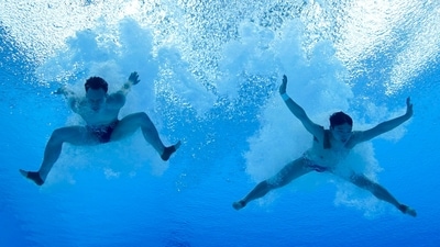 Tokyo: Gold medal winners China's Wang Zongyuan and Xie Siyi compete in the synchronized 3-meter springboard final at the 2020 Summer Olympics, Wednesday, July 28, 2021, in Tokyo.AP/PTI(AP07_28_2021_000138B) (AP) Tokyo: Gold medal winners China's Wang Zongyuan and Xie Siyi compete in the synchronized 3-meter springboard final at the 2020 Summer Olympics, Wednesday, July 28, 2021, in Tokyo.AP/PTI(AP07_28_2021_000138B) (AP)