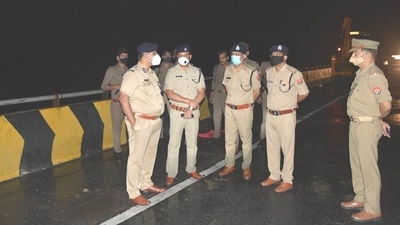 Uttar Pradesh: Barabanki police at the accident site after a speeding truck collided with a bus over the Lucknow-Ayodhya national highway. (Photo via @adgzonelucknow on Twitter) Uttar Pradesh: Barabanki police at the accident site after a speeding truck collided with a bus over the Lucknow-Ayodhya national highway. (Photo via @adgzonelucknow on Twitter)