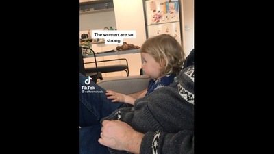 The image shows the little girl watching an Olympic event. (Reddit/@lilmcfuggin)