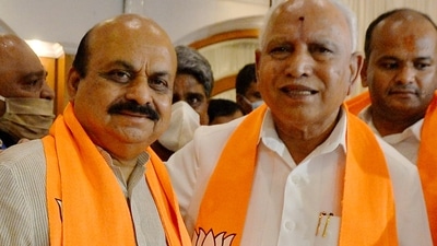 Newly elected Karnataka chief minister Basavaraj Bommai (L) with his predecessor BS Yediyurappa during the BJP legislature party meeting in Bengaluru, on Tuesday, (PTI) Newly elected Karnataka chief minister Basavaraj Bommai (L) with his predecessor BS Yediyurappa during the BJP legislature party meeting in Bengaluru, on Tuesday, (PTI)