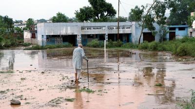 An elderly man walks through thick sludge due to heavy rainfall in Jammu earlier this month. (File photo) An elderly man walks through thick sludge due to heavy rainfall in Jammu earlier this month. (File photo)