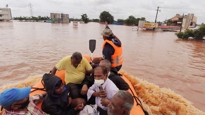 People stranded in flood waters are rescued Kolhapur in western Maharashtra. (AP file photo)