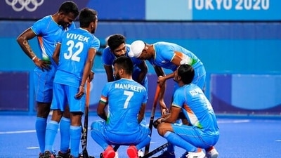 India's Manpreet Singh (7) huddles with his teammates. (AP) India's Manpreet Singh (7) huddles with his teammates. (AP)