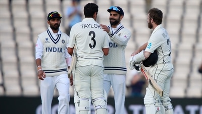 India's captain Virat Kohli, second right, congratulates New Zealand's Ross Taylor and captain Kane Williamson, right, on their win on the sixth day of the World Test Championship final cricket match between New Zealand and India (AP) India's captain Virat Kohli, second right, congratulates New Zealand's Ross Taylor and captain Kane Williamson, right, on their win on the sixth day of the World Test Championship final cricket match between New Zealand and India (AP)