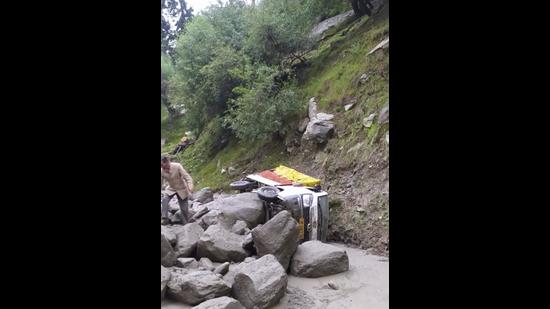 A truck that was washed away in the flashflood in Tozing Nullah in Lahaul and Spiti district of Himachal Pradesh on Wednesday. (HT Photo)