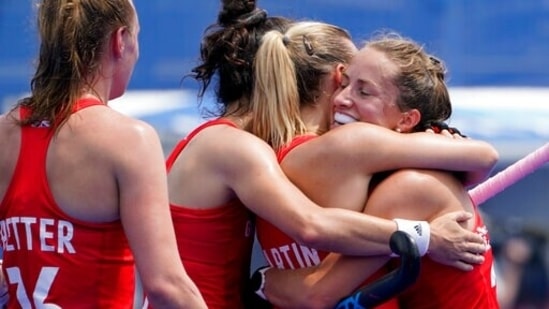 Britain's Hannah Martin, center right, celebreates with Shona McCallin, right, after scoring on India goalkeeper Savita during a women's field hockey match at the 2020 Summer Olympics, Wednesday, July 28, 2021, in Tokyo, Japan. (AP Photo/John Minchillo)(AP)