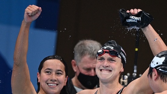 First placed USA's Kathleen Ledecky (R) and second places USA's Erica Sullivan celebrate after the final of the women's 1500m freestyle swimming event during the Tokyo 2020 Olympic Games at the Tokyo Aquatics Centre in Tokyo on July 28, 2021. (Photo by Oli SCARFF / AFP)(AFP)