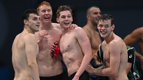 (From L) Britain's James Guy, Britain's Tom Dean, Britain's Duncan Scott and Britain's Matthew Richards react after winning the final of the men's 4x200m freestyle relay swimming event during the Tokyo 2020 Olympic Games at the Tokyo Aquatics Centre in Tokyo on July 28, 2021. (Photo by Oli SCARFF / AFP)(AFP)