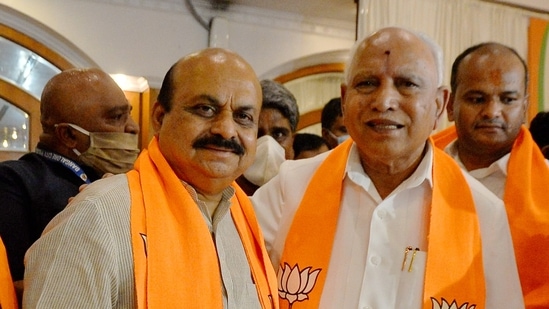 Bengaluru: Newly-elected Karnataka chief minister Basavaraj Bommai (L) with outgoing state chief minister BS Yediyurappa during the BJP legislature party meeting in Bengaluru, on Tuesday, July 27, 2021. (PTI)