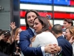 Vlad Tenev, CEO and co-founder Robinhood Markets, Inc., embraces his wife Celina Tenev during his company’s IPO at the Nasdaq Market site in Times Square in New York City.(Reuters)