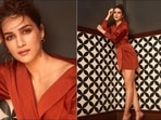 Mimi: Kriti Sanon looks fabulously hot in a flirty satin brown wrap dress