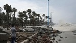 A man takes pictures as waves lash over onto a damaged shoreline during Cyclone Yaas. (AFP) A man takes pictures as waves lash over onto a damaged shoreline during Cyclone Yaas. (AFP)