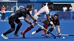 India Harmanpreet Singh is tackled by Argentina's Nahuel Salis (L) and Agustin Alejandro Mazzilli during their men's pool A match of the Tokyo 2020 Olympic Games(AFP) India Harmanpreet Singh is tackled by Argentina's Nahuel Salis (L) and Agustin Alejandro Mazzilli during their men's pool A match of the Tokyo 2020 Olympic Games(AFP)