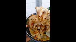 The image shows the 'papad aglio e olio' dish.