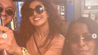 Priyanka is all smiles as she posed with her friends on a rainy day. (Instagram/@priyankachopra)