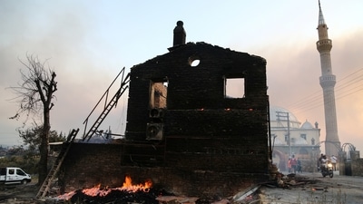 Agriculture Minister Bekir Pakdemirli said authorities were battling the flames with a firefighting plane, 19 helicopters, 108 vehicles and some 400 personnel.  (REUTERS/Kaan Soyturk)