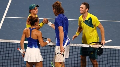 Tokyo 2020 Olympics - Tennis - Mixed Doubles - Quarterfinal - Ariake Tennis Park - Tokyo, Japan - July 29, 2021 Ashleigh Barty of Australia and John Peers of Australia shake hands with Maria Sakkari of Greece and Stefanos Tsitsipas of Greece after winning their quarterfinal match REUTERS/Edgard Garrido (REUTERS)