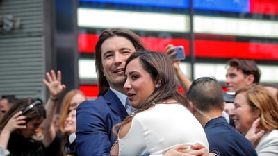 Vlad Tenev, CEO and co-founder Robinhood Markets, Inc., embraces his wife Celina Tenev during his company’s IPO at the Nasdaq Market site in Times Square in New York City. (Reuters)
