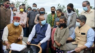 Himachal chief minister Jai Ram Thakur interacting with locals at Mandi’s Karsog on Thursday. (HT Photo)