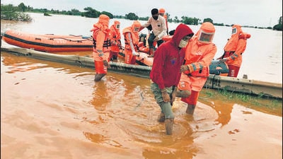 National Disaster Response Force (NDRF) team carries out rescue and relief operations at a flood-affected area in Karnataka’s Belagavi on Saturday. (ANI) National Disaster Response Force (NDRF) team carries out rescue and relief operations at a flood-affected area in Karnataka’s Belagavi on Saturday. (ANI)