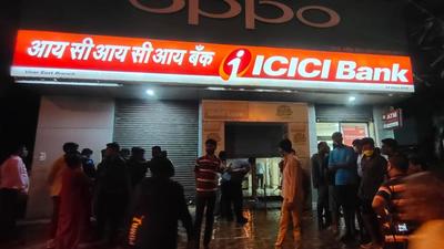 The bank was half shuttered and just two women employees were inside the bank.