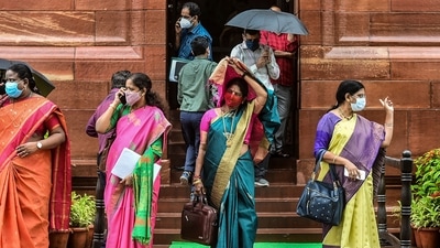 YSR Congress party leader Geetha Viswanath (C) and others taking cover from the rain while at the Parliament for the Monsoon Session, in New Delhi on July 28. (Arun Sharma / PTI) YSR Congress party leader Geetha Viswanath (C) and others taking cover from the rain while at the Parliament for the Monsoon Session, in New Delhi on July 28. (Arun Sharma / PTI)
