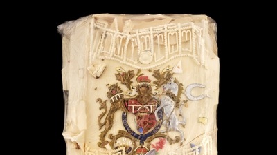In this photo provided by Dominic Winter Auctioneers, a slice of cake from one of the 23 official wedding cakes made for the Royal Wedding of Britain's Prince Charles and Lady Diana Spencer is seen. It is now up for auction. The cake was given to Moyra Smith, a member of the Queen Mother's household at Clarence House, who preserved the topping with cling film. (Dominic Winter Auctioneers via AP) In this photo provided by Dominic Winter Auctioneers, a slice of cake from one of the 23 official wedding cakes made for the Royal Wedding of Britain's Prince Charles and Lady Diana Spencer is seen. It is now up for auction. The cake was given to Moyra Smith, a member of the Queen Mother's household at Clarence House, who preserved the topping with cling film. (Dominic Winter Auctioneers via AP)