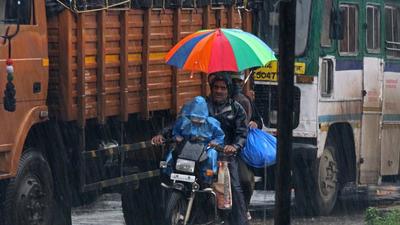 A family out in rain on a bike in Pune. Pune district receives excess rainfall in July. (HT) A family out in rain on a bike in Pune. Pune district receives excess rainfall in July. (HT)