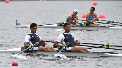 India's Arjun Lal Jat and Arvind Singh (foreground) cross the finish line in the lightweight men's double sculls heat at the 2021 World Rowing Asia-Oceania Olympic and Paralympic Continental Qualifying Regatta in Tokyo on May 6, 2021, where the Olympic and Paralympic Games events will be held. (Photo by Kazuhiro NOGI / AFP) (AFP)
