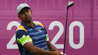 India's Anirban Lahiri watches his drive from the 1st tee in round 1 of the men�s golf individual stroke play during the Tokyo 2020 Olympic Games at the Kasumigaseki Country Club in Kawagoe on July 29, 2021. (Photo by Kazuhiro NOGI / AFP) (AFP)