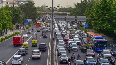 Thursday’s spell of rain, which coincided with the peak traffic hours, was enough to bring traffic to a screeching halt on some of the city’s most crucial arterial roads. (PTI Photo / Manvender Vashist) Thursday’s spell of rain, which coincided with the peak traffic hours, was enough to bring traffic to a screeching halt on some of the city’s most crucial arterial roads. (PTI Photo / Manvender Vashist)