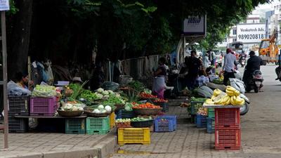 Illegal vegetable and fruit vendors encroach footpath and road on the Gangadham to Katraj - Kondhwa road stretch, in Pune on Wednesday. Residents frustrated over poor, unsafe road conditions in locality. (RAVINDRA JOSHI/HT) Illegal vegetable and fruit vendors encroach footpath and road on the Gangadham to Katraj - Kondhwa road stretch, in Pune on Wednesday. Residents frustrated over poor, unsafe road conditions in locality. (RAVINDRA JOSHI/HT)
