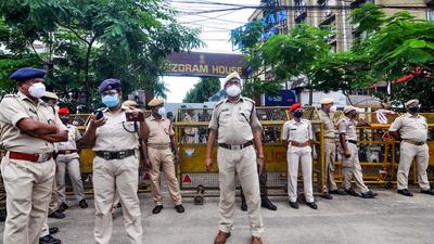 Assam security personnel stand vigil outside Mizoram House in Guwahati on Thursday. (PTI) Assam security personnel stand vigil outside Mizoram House in Guwahati on Thursday. (PTI)