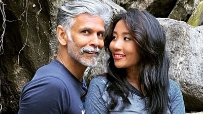 Ankita Konwar and Milind Soman pose together.