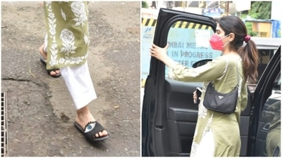 She kept her look casual by wearing black sliders and accessorised it with a black shoulder bag. (HT Photo)